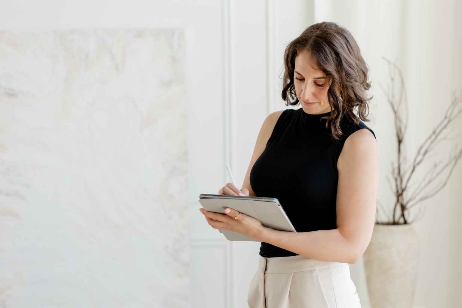 Dr. Ashley Kennedy reviewing notes on a tablet